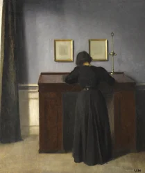 Ida de pie en un escritorio, 1900