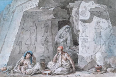 Familia egipcia fuera de una tumba antigua