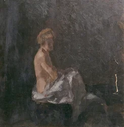Desnudo femenino contra un fondo oscuro