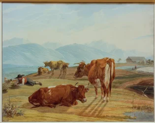 Vacas pastando frente a paisaje montañoso