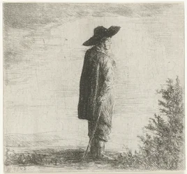 Hombre con sombrero y palo en paisaje