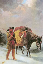 Trampero de pieles cruzando las montañas