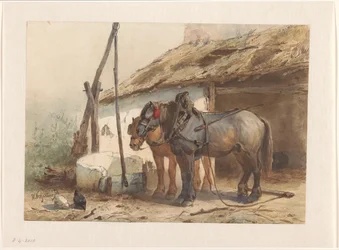 Dos caballos parados frente a un establo